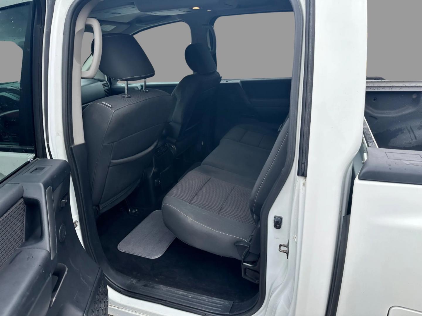 2013 White /Black Nissan Titan Pro-4X (1N6AA0EC0DN) with an 5.6L DOHC 32V V8 engine, Automatic transmission, located at 547 E. Main St., Orwell, OH, 44076, (440) 437-5893, 41.535435, -80.847855 - This 2013 Nissan Titan Pro-4X Crew Cab is a capable and well-equipped full-size pickup truck. It features a powerful 5.6L Endurance V8 engine paired with a 5-speed automatic transmission, a locking rear differential for improved traction, and a maximum towing capacity of 9,300 pounds. The truck is l - Photo#23